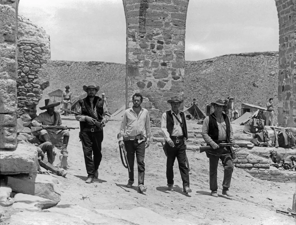 The Wild Bunch  Year : 1969 USA Director : Sam Peckinpah Ben Johnson, Warren Oates, William Holden, Ernest Borgnine Restricted to editorial use. See caption for more information about restrictions. It is forbidden to reproduce the photograph out of context of the promotion of the film. It must be credited to the Film Company and/or the photographer assigned by or authorized by/allowed on the set by the Film Company. Restricted to Editorial Use. Photo12 does not grant publicity rights of the persons represented. (Photo by 7e Art/Warner Bros/Seven Arts / Photo12 via AFP)