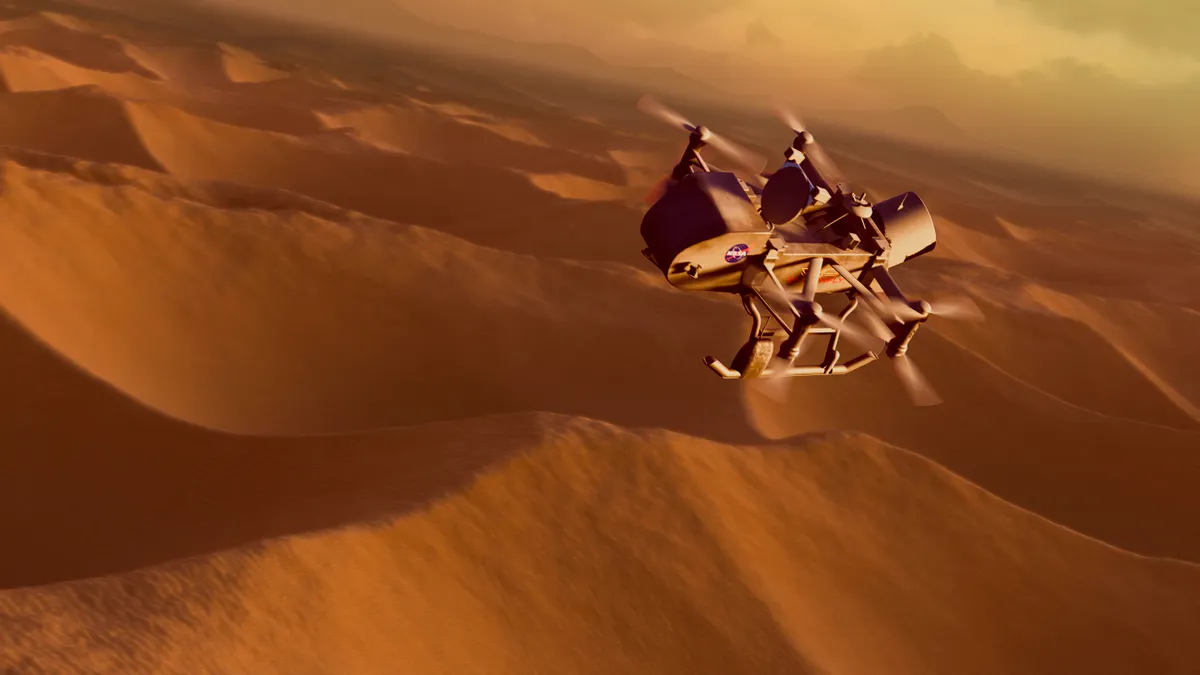 Artwork depicting the NASA drone/probe called Dragonfly. Scheduled for launch in 2028, this probe will visit Titan. Dragonfly, upon arrival in 2034, will search for signs of prebiotic chemical processes common on both Titan and the early Earth before life developed. It will not explore the lakes, but one of the regions it is scheduled to visit resembles a terrestrial dunefield, as shown here. (Photo by MARK GARLICK/SCIENCE PHOTO LIBRA / MGA / Science Photo Library via AFP)