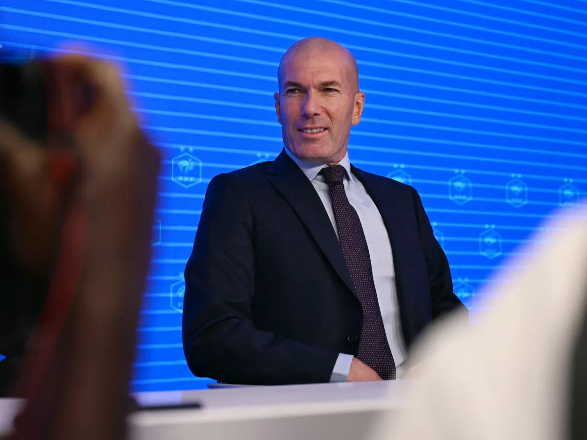 Former French international football player Zinedine Zidane arrives at the press conference to present him as the new head coach of France national football team at the French Football Federation headquarters (FFF) in Paris on July 28, 2026. The former France playmaker, who won the 1998 World Cup and the 2000 European Championship as a player, has been appointed head coach of the French national team, succeeding Didier Deschamps, the French Football Federation (FFF) announced. Zidane takes over from his former teammate Deschamps, who had been in charge since 2012; Deschamps' tenure ended with a fourth-place finish at the 2026 World Cup, following a title win in 2018 and a final appearance in 2022. (Photo by LOU BENOIST / AFP)