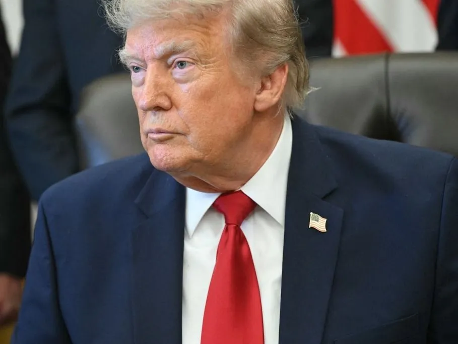 US President Donald Trump looks on after signing an executive order to drastically shrink two national monuments in Utah, paving the way for fossil fuel extraction and mining, at the Oval Office of the White House in Washington, DC, on July 13, 2026. The issue has become something of a political football. Previously, President Trump had targeted the two monuments, Bears Ears and Grand Staircase-Escalante, during his first term in 2017, before his Democratic successor, Joe Biden, restored them to their original boundaries in 2021. (Photo by SAUL LOEB / AFP)