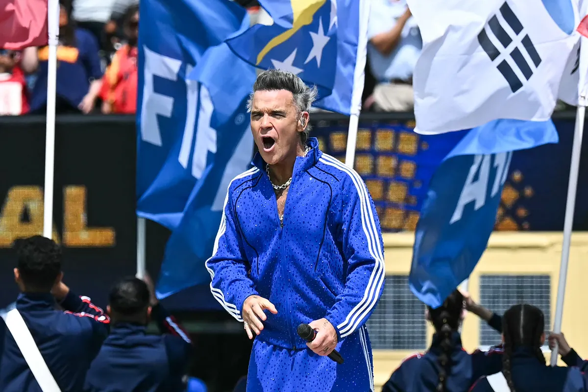 British singer-Songwriter Robbie Williams performs the FIFA anthem 'Desire' during the closing ceremony of the 2026 World Cup football tournament final match between Spain and Argentina at the New York/New Jersey Stadium in East Rutherford on July 19, 2026.  (Photo by Paul ELLIS / AFP)