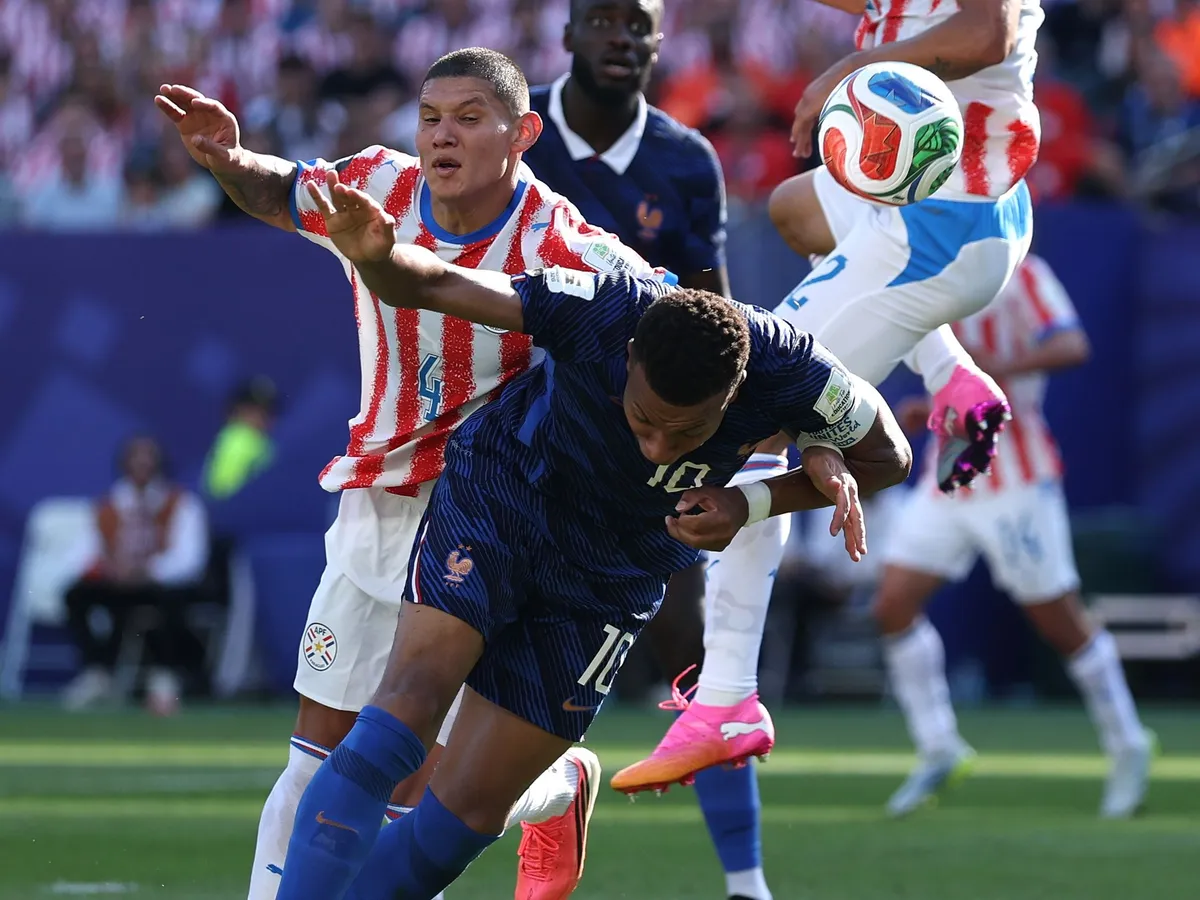 PHILADELPHIA, PENNSYLVANIA - JULY 04: Kylian Mbappe #10 of France and Juan Jose Caceres #4 of Paraguay compete for the ball during the FIFA World Cup 2026 Round of 16 match between Paraguay and France at Philadelphia Stadium on July 04, 2026 in Philadelphia, Pennsylvania. (Photo by Buda Mendes/Getty Images)
