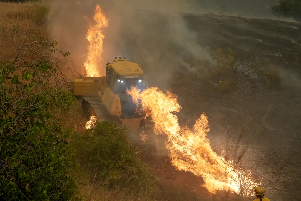 Firefighters battle a wildfire in Cebreros area, near Avila, 80 kms west of Madrid on July 24, 2026. Spain declared a national emergency in the Madrid region and in the province of Avila, near the capital, on July 23, 2026, in the wake of several wildfire