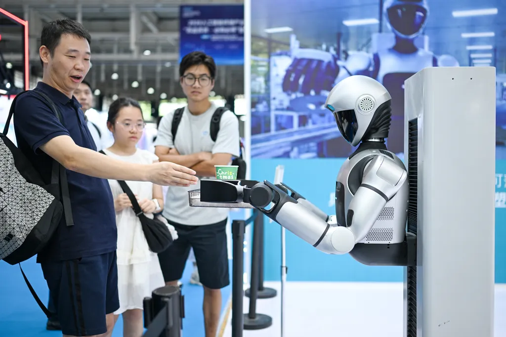 A robot delivers coffee to visitors at the 2026 Artificial Intelligence Terminal Industry Expo in Nanjing, Jiangsu Province, China, on July 10, 2026. (Photo by Costfoto/NurPhoto via Getty Images) robot