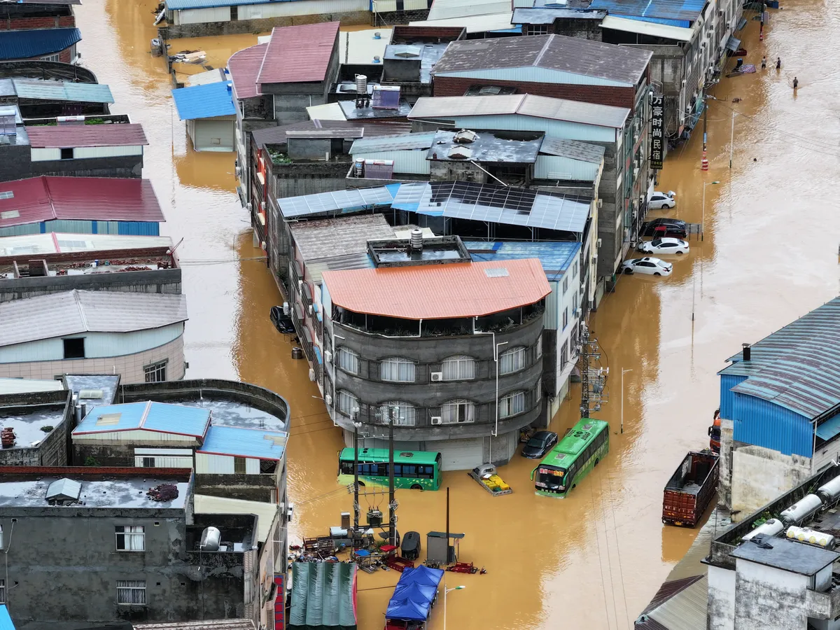 An aerial view shows flooding in Pingshan village at Xiaoyi town in Hengzhou, China's southern Guangxi region on July 6, 2026. (Photo by CNS / AFP) / China OUT