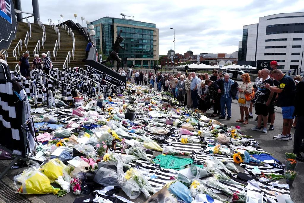 People observe tributes outside St James' Park, Newcastle to former England forward and manager Kevin Keegan who has died aged 75. Picture date: Wednesday July 22, 2026.,Image: 1117884816, License: Rights-managed, Restrictions: Use subject to restrictions