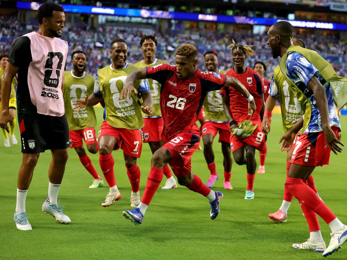 MIAMI GARDENS, FLORIDA - JUNE 21: Helio Varela #26 of Cabo Verde celebrates with teammates after scoring the team's second goal during the FIFA World Cup 2026 Group H match between Uruguay and Cabo Verde at Miami Stadium on June 21, 2026 in Miami Gardens, Florida.   Alex Slitz/Getty Images/AFP (Photo by Alex Slitz / GETTY IMAGES NORTH AMERICA / Getty Images via AFP)