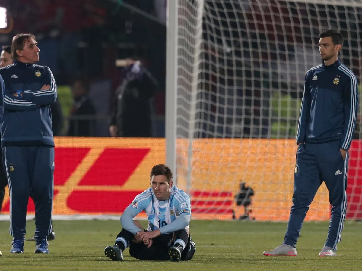 (150705) -- SANTIAGO, July 5, 2015 () -- Lionel Messi (C) of Argentina reacts after the final match of the Copa America Chile 2015 against Chile, at the National Stadium, in Santiago, capital of Chile, on July 4, 2015. Chile won the final match of the Copa America 2015 against Argentina after the penalty kick 4-1. (/Guillermo Arias) (ce) (Photo by Guillermo Arias / NurPhoto via AFP)