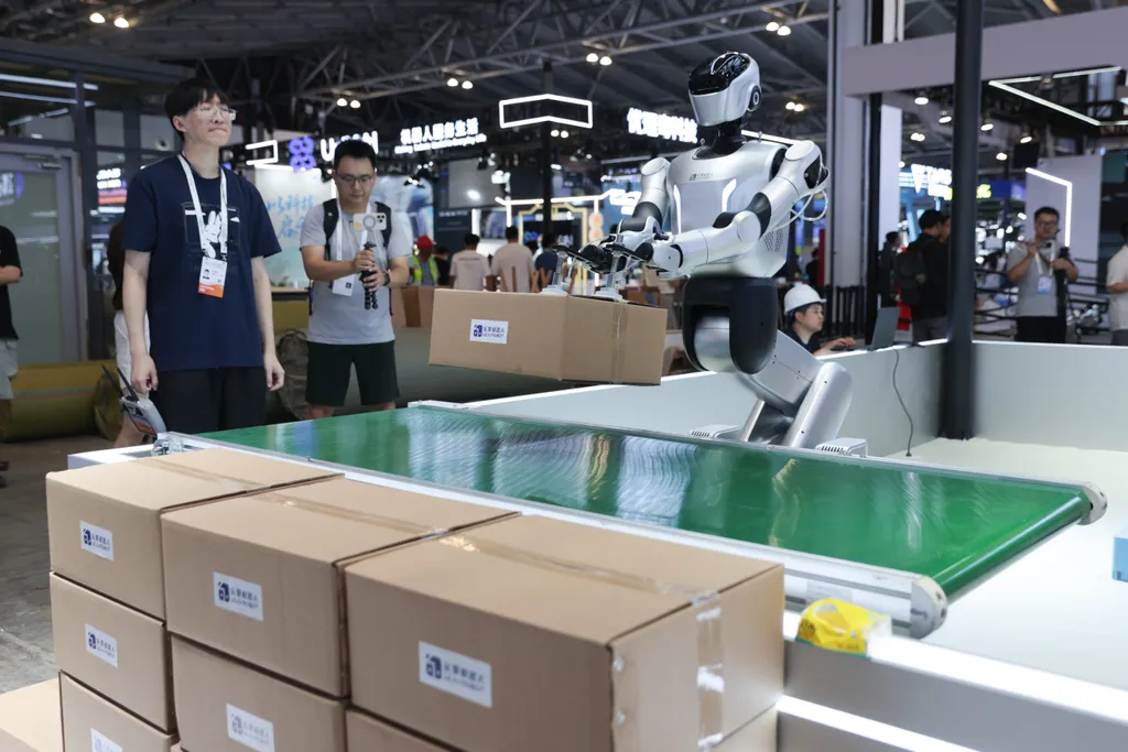 SHANGHAI, CHINA - JULY 16: A humanoid robot by Leju Robotics demonstrates a carton depalletizing solution on July 16, 2026 in Shanghai, China. The 2026 World Artificial Intelligence Conference and High-Level Meeting on Global AI Governance will run from J