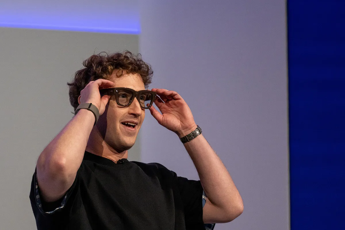 Mark Zuckerberg, chief executive officer of Meta Platforms Inc., wears a pair of Meta Ray-Ban Display AI glasses during the Meta Connect event in Menlo Park, California, US, on Wednesday, Sept. 17, 2025. Meta Platforms, seeking to turn its burgeoning smart glasses into a must-have product unveiled its first version with a built-in screen. Photographer: David Paul Morris/Bloomberg via Getty Images