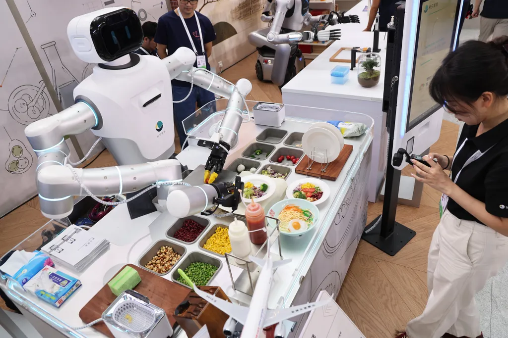 SHANGHAI, CHINA - JULY 17: A humanoid robot prepares a healthy meal during the 2026 World AI Conference and High-Level Meeting on Global AI Governance on July 17, 2026 in Shanghai, China. Themed "AI Partnership for a Brighter Future," the event will inclu