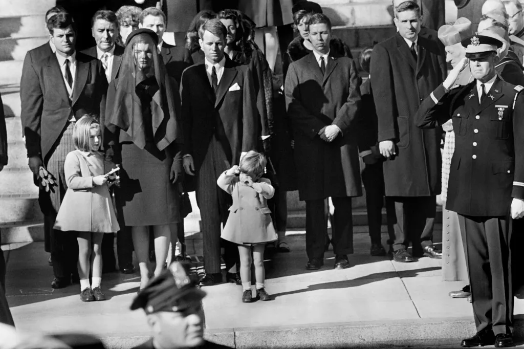 Jacqueline Kennedy stands with her two children Caroline Kennedy and John F. Kennedy Jr and brothers-in law Ted Kennedy (L, back) and Robert Kennedy (R) at the funeral of her husband US President John F. Kennedy 25 November 1963 in Washington, DC. A plane piloted by John F. Kennedy, Jr. was missing 17 July 1999 after departing from a small airport near New York City en route to Martha's Vineyard, MA. AFP PHOTO (Photo by AFP)