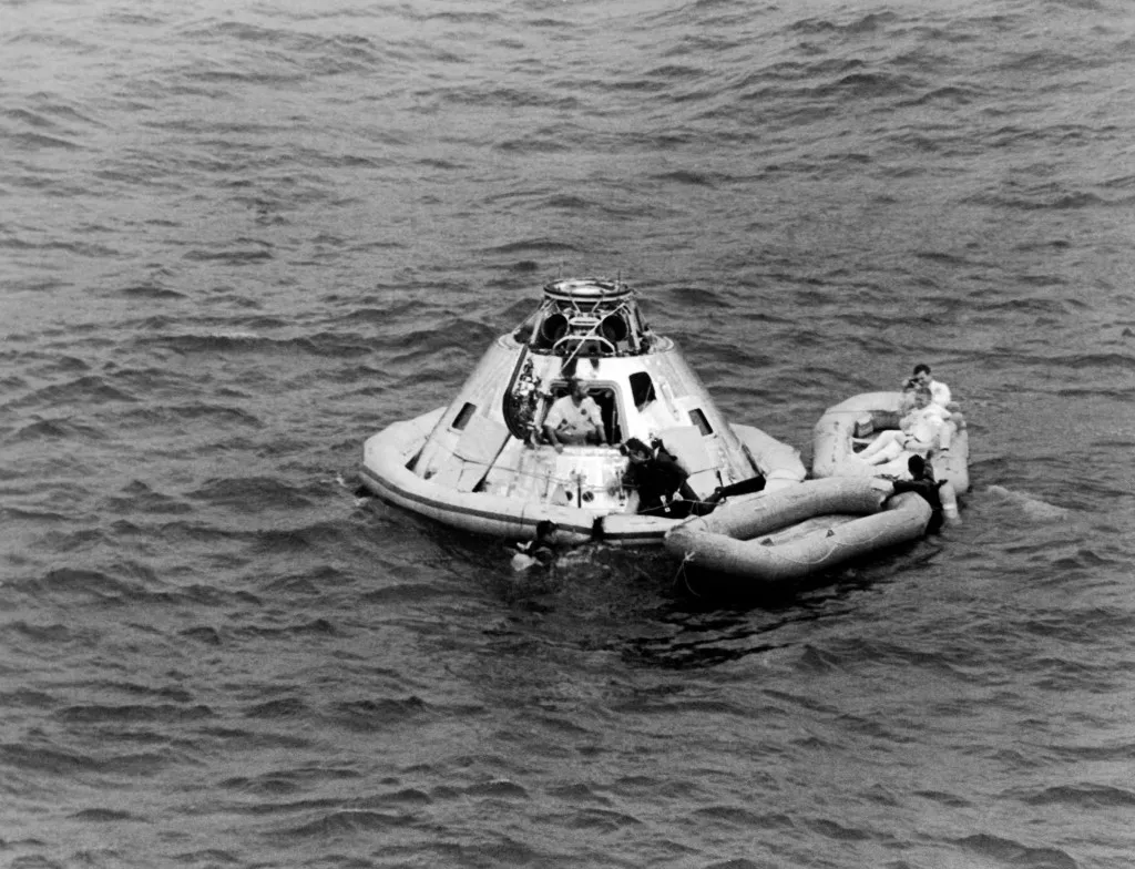 A picture taken on March 13, 1969 in the Ocean, east of the Bahamas, shows the astronauts James A. McDivitt, David R. Scott and Russell L. Schweickart walking out from the cabin after the splashdown  of the Apollo 9 spacecraft, the first manned flight of the Command Service Module with the Lunar Module.  AFP PHOTO / NASA (Photo by Handout / NASA / AFP) / RESTRICTED TO EDITORIAL USE - MANDATORY CREDIT "AFP PHOTO / NASA " - NO MARKETING NO ADVERTISING CAMPAIGNS - DISTRIBUTED AS A SERVICE TO CLIENTS