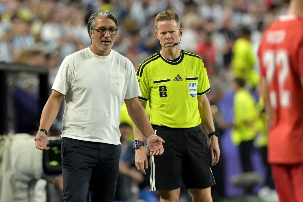 Switzerland's head coach Murat Yakin gestures during the 2026 World Cup football tournament quarter-final match between Argentina and Switzerland at the Kansas City Stadium in Kansas City on July 11, 2026.  (Photo by JUAN MABROMATA / AFP)