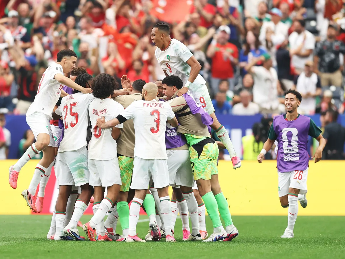HOUSTON, TEXAS - JULY 04: Players of Morocco celebrate the team's first goal scored by Azzedine Ounahi #8 (obscured) during the FIFA World Cup 2026 Round of 16 match between Canada and Morocco at Houston Stadium on July 04, 2026 in Houston, Texas. (Photo by Molly Darlington/Getty Images)