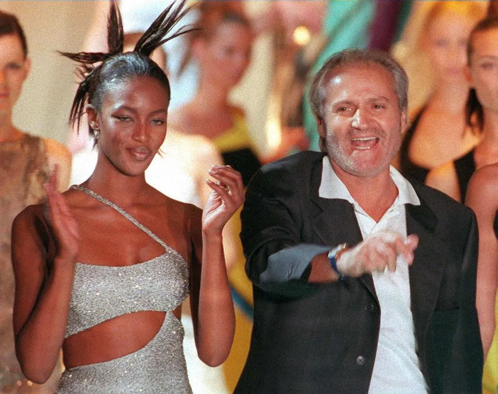 File photo dated 08 March 96 showing Italian fashion designer Gianni Versace (R) with top model Naomi Campbell during the presentation of the Automn/Winter  96/97 High Fashion collection at Paris. Versace was shot dead in front of his house in South Beach, Miami, 15 July 1997. (Photo by THOMAS COEX / AFP)