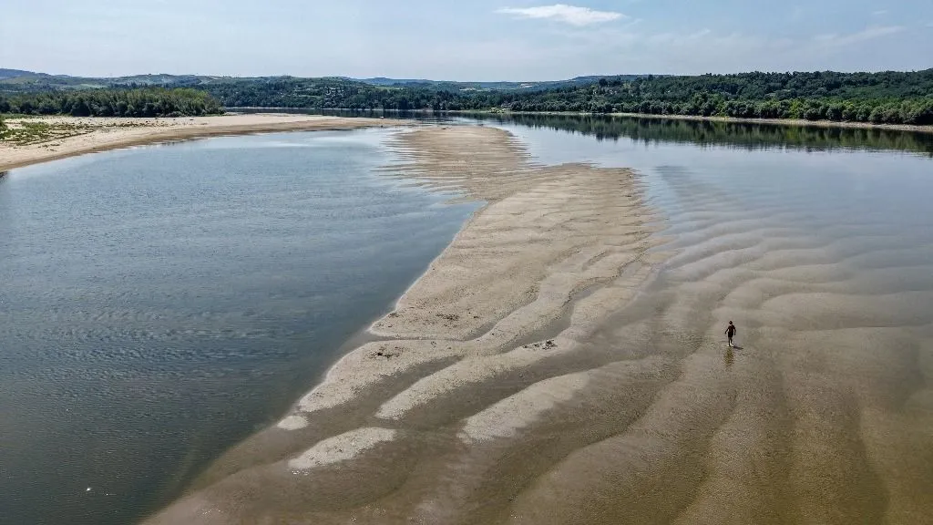 This aerial view shows the low water level of the Danube River near Backa Palanka, Serbia, on July 19, 2026. (Photo by Nenad MIHAJLOVIC / AFP)