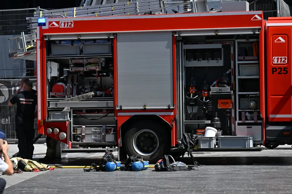 the scene of a fire at the OXY building at place De Brouckere, in Brussels, Tuesday 14 July 2026s. The Brussels Labour Inspectorate confirms several bodies were found in the lift shafts, 6 people are still missing. The fire broke out on the second floor of the building that is currently being renovated.
BELGA PHOTO EMILE WINDAL (Photo by EMILE WINDAL / BELGA MAG / Belga via AFP)