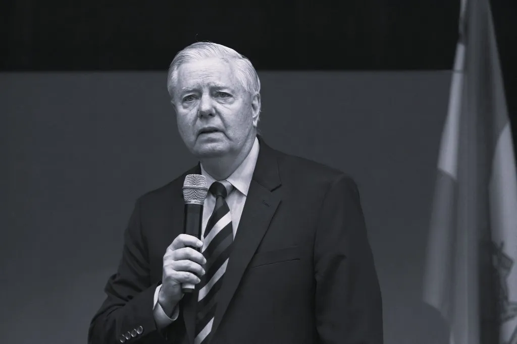 FILED - 14 February 2026, Bavaria, Munich: U.S. politician Lindsey Graham is on stage at a demonstration on the Theresienwiese held on the sidelines of the Munich Security Conference under the slogan “Human Rights and Freedom in Iran: International Solidarity with the Iranian People.” A statement from his office posted on his X and Facebook profiles stated that Graham had died on July 11, 2026, following a brief but serious illness. Photo: Felix Hörhager/dpa (Photo by Felix Hörhager / dpa Picture-Alliance via AFP)