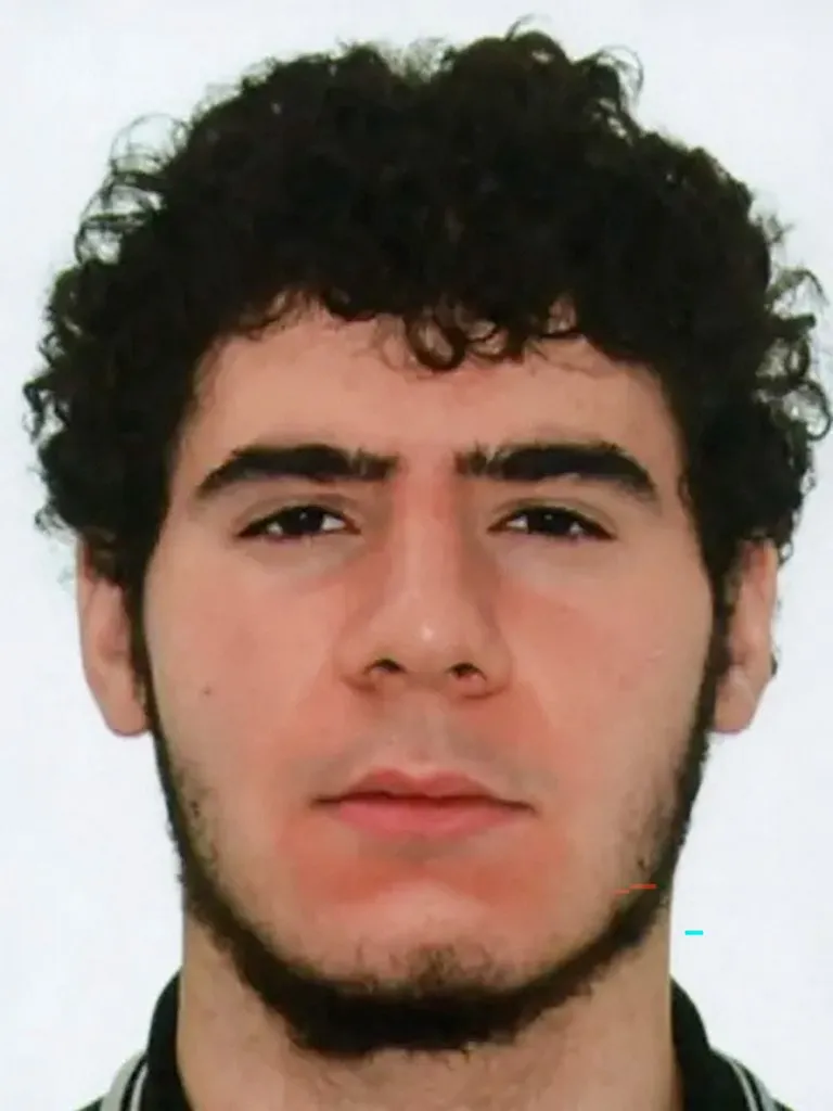A police handout photo released on July 26, 2026 by Berlin Police shows Abdul B., the suspected perpetrator of the car ramming attack on people near Berlin's Christopher Street Day (CSD) parade on late July 25, 2026, who has been "identified" but not yet arrested and is believed to have links to "Islamist circles", as a police spokesman said. German police searched on July 26, 2026 for a suspect believed linked to Islamist circles after a car ploughed into a crowd near Berlin's Gay Pride celebrations, killing one person and wounding 16 others. The incident shattered what had been a day of celebration for hundreds of thousands attending Christopher Street Day, one of Europe's largest Pride events, and left revellers fleeing a central Berlin park as sirens echoed through the night. (Photo by POLIZEI BERLIN / AFP) / RESTRICTED TO EDITORIAL USE - MANDATORY CREDIT "AFP PHOTO / POLIZEI BERLIN" - HANDOUT - NO MARKETING NO ADVERTISING CAMPAIGNS - DISTRIBUTED AS A SERVICE TO CLIENTS