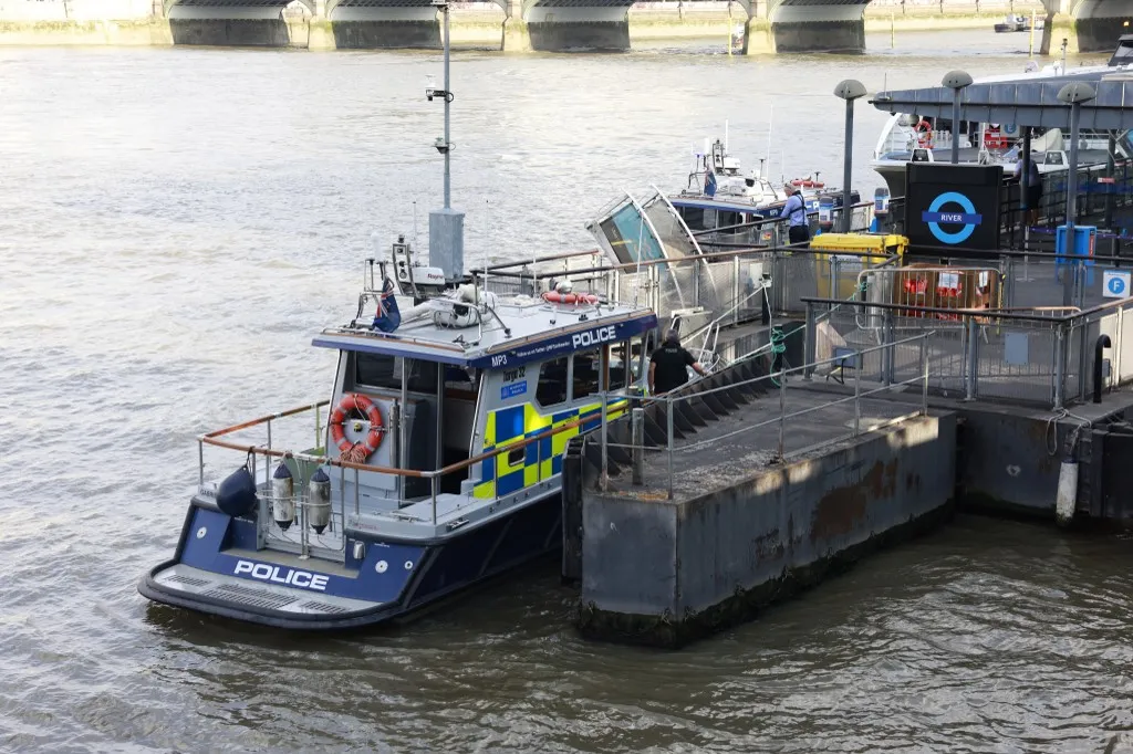 A Metropolitan police boat is seen moored near the scene of an incident involving a boat crashing into the bridge in central London on July 24, 2026, injuring a number of officers from the Met's Marine Policing Unit. Five London police officers were injured Friday after their boat patrolling the River Thames struck Westminster Bridge and they went into the water, the UK capital's Metropolitan Police Service said. (Photo by Brook Mitchell / AFP)