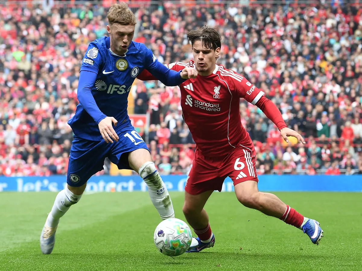 Liverpool's Hungarian defender #06 Milos Kerkez (R) fouls Chelsea's English midfielder #10 Cole Palmer during the English Premier League football match between Liverpool and Chelsea at Anfield in Liverpool, north west England on May 9, 2026. (Photo by PETER POWELL / AFP) / RESTRICTED TO EDITORIAL USE. No use with unauthorized audio, video, data, fixture lists, club/league logos or 'live' services. Online in-match use limited to 120 images. An additional 40 images may be used in extra time. No video emulation. Social media in-match use limited to 120 images. An additional 40 images may be used in extra time. No use in betting publications, games or single club/league/player publications. /