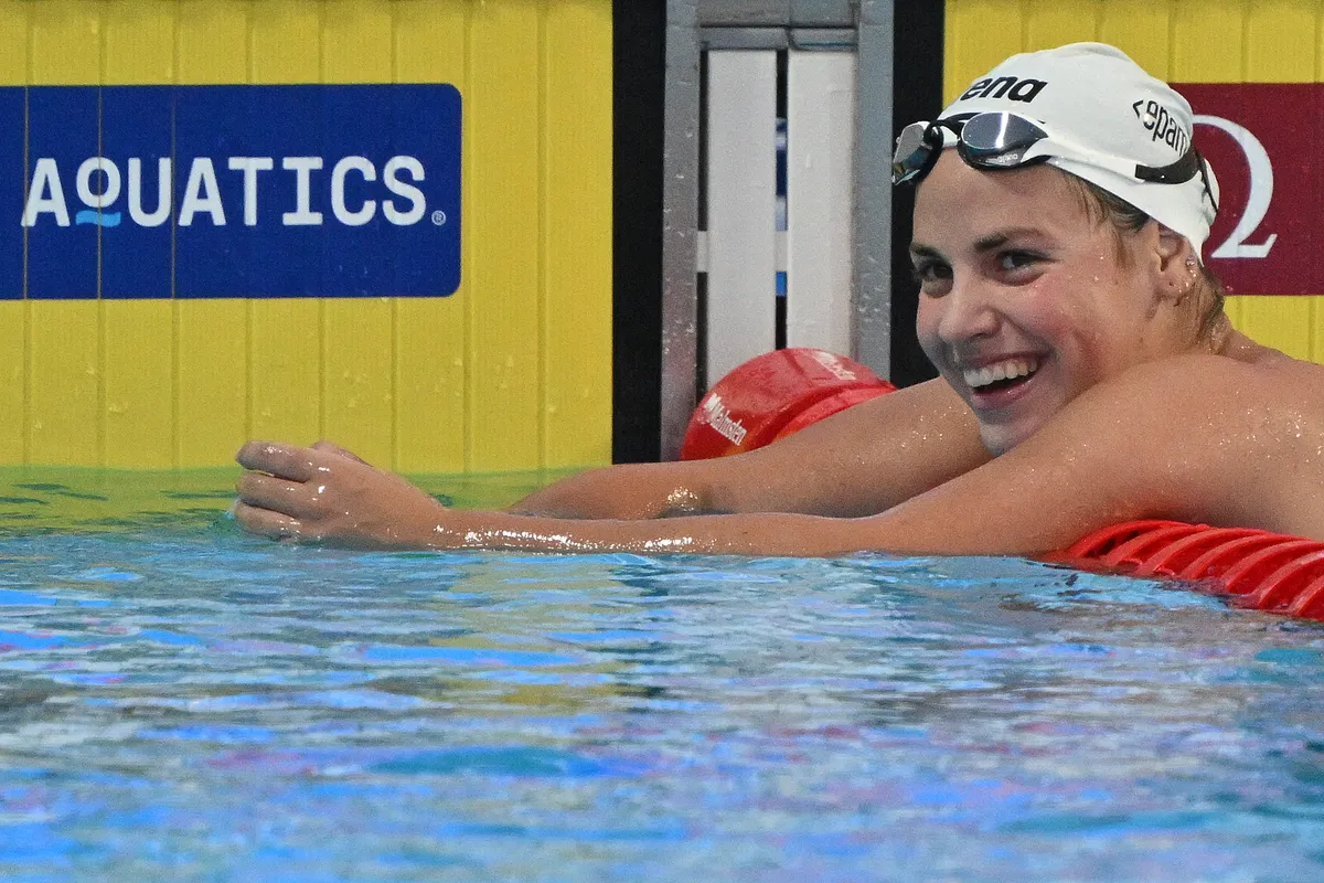 Hungary's Vivien Jackl celebrates placing first in the Swimming Women's 1500m Freestyle Final during the LEN European Aquatics Championships, at the Milan Gale Muskatirovic sports centre in Belgrade, on June 21, 2024. (Photo by ANDREJ ISAKOVIC / AFP) / The erroneous mention[s] appearing in the metadata of this photo by ANDREJ ISAKOVIC has been modified in AFP systems in the following manner: [Vivien Jackl] instead of [Vicien Jackl]. Please immediately remove the erroneous mention[s] from all your online services and delete it (them) from your servers. If you have been authorized by AFP to distribute it (them) to third parties, please ensure that the same actions are carried out by them. Failure to promptly comply with these instructions will entail liability on your part for any continued or post notification usage. Therefore we thank you very much for all your attention and prompt action. We are sorry for the inconvenience this notification may cause and remain at your disposal for any further information you may require.