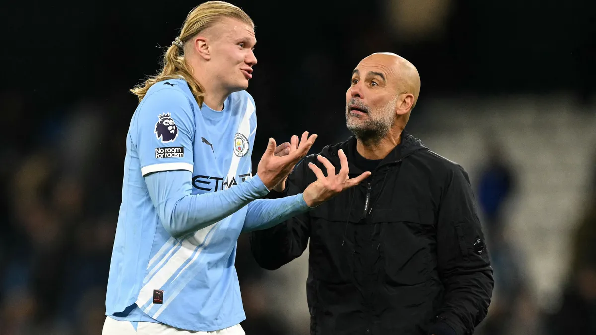 Manchester City's Norwegian striker #09 Erling Haaland (L) reacts with Manchester City's Spanish manager Pep Guardiola after the English Premier League football match between Manchester City and Leeds United at the Etihad Stadium in Manchester, north west England, on November 29, 2025. (Photo by Oli SCARFF / AFP) / RESTRICTED TO EDITORIAL USE. No use with unauthorized audio, video, data, fixture lists, club/league logos or 'live' services. Online in-match use limited to 120 images. An additional 40 images may be used in extra time. No video emulation. Social media in-match use limited to 120 images. An additional 40 images may be used in extra time. No use in betting publications, games or single club/league/player publications. /
