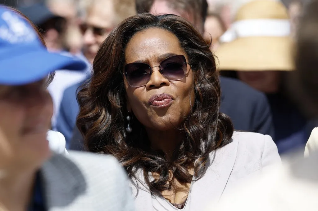 US TV host and producer Oprah Winfrey attends opening day of the Barack Obama Presidential Center in Chicago, Illinois, on June 18, 2026. (Photo by Kamil Krzaczynski / AFP)