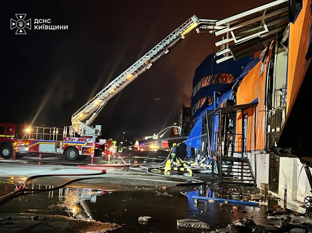 This handout photograph taken and released by Ukrainian State Emergency Service on August 5, 2026 shows rescuers putting out a fire in a warehouse premises damaged following massive Russian ballistic missile and drones strikes in the Ukrainian capital of Kyiv, amid the Russian invasion in Ukraine. Russian missile and drone strikes killed at least 17 people and wounded dozens more in Kyiv and the surrounding region overnight, authorities said August 5, 2026, the latest in a wave of deadly attacks on Ukraine. Kyiv was unable to shoot down any of the missiles launched by Russia, whose intensifying missile attacks have prompted Kyiv to plead for more US-made Patriot interceptors. (Photo by Handout / Ukrainian State Emergency Service / AFP)