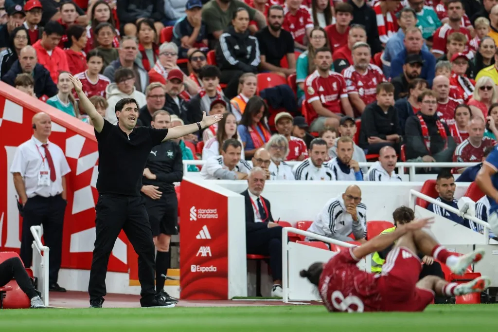Liverpool's Spanish head coach Andoni Iraola (L) reacts during the pre-season friendly football match between Liverpool and Como at Anfield in Liverpool, north west England on August 16, 2026. (Photo by Darren Staples / AFP)