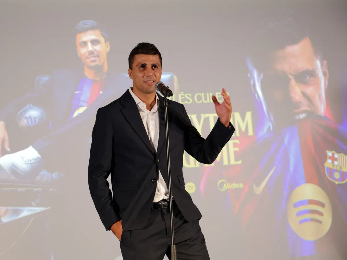 Spanish international footballer Rodri talks during his official presentation as FC Barcelona's new player on August 18, 2026 in Barcelona. Barcelona announced the signing of Rodri from Manchester City until 2030, AFP reports on August 18, 2026. (Photo by Lluis GENE / AFP)
