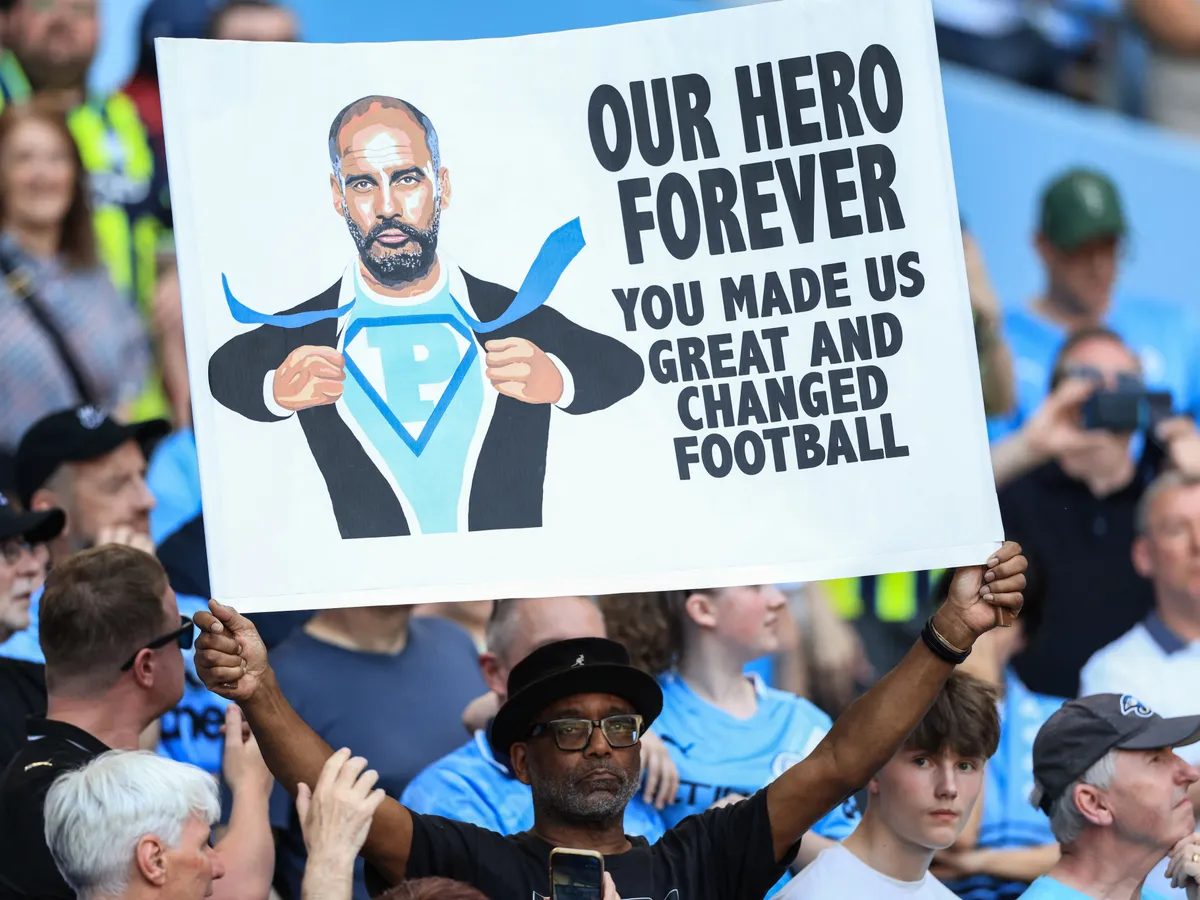 A supporter holds up a sign in honour of Manchester City's Spanish manager Pep Guardiola during ceremonies to honour those leaving the club, including Guardiola, at the end of the season, following the English Premier League football match between Manchester City and Aston Villa at the Etihad Stadium in Manchester, north west England, on May 24, 2026. (Photo by Darren Staples / AFP) / RESTRICTED TO EDITORIAL USE. No use with unauthorized audio, video, data, fixture lists, club/league logos or 'live' services. Online in-match use limited to 120 images. An additional 40 images may be used in extra time. No video emulation. Social media in-match use limited to 120 images. An additional 40 images may be used in extra time. No use in betting publications, games or single club/league/player publications. /
