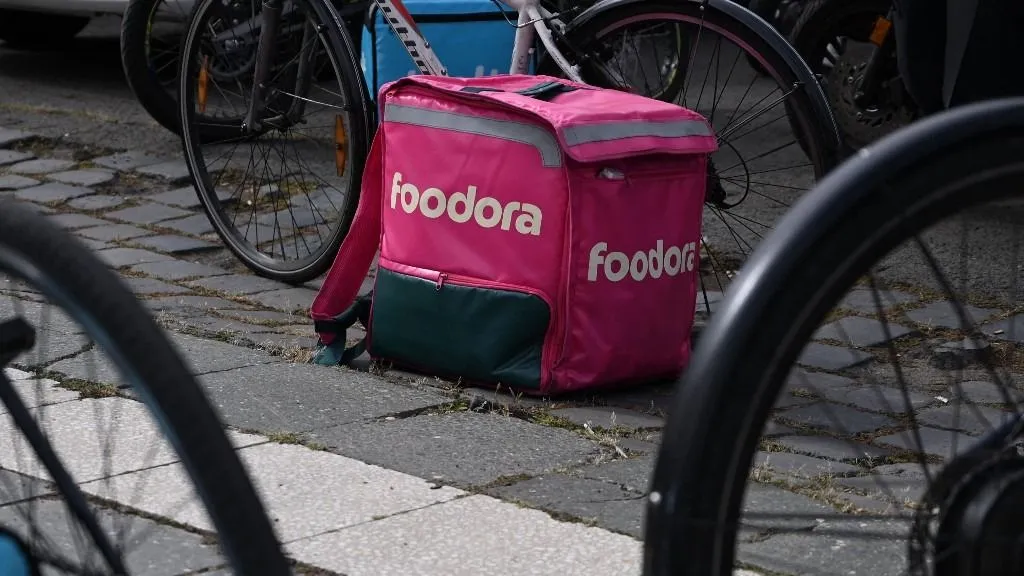 A bag of a "Foodora" delivery service courier is pictured during a protest against poor working conditions in Budapest on September 18, 2025. Organiser Gergely Toth told AFP that according to his estimates, their incomes fallen more than 40-50 percent over the past four years on average when adjusted to inflation. Riders also demand that delivery platforms should implement a more transparent scheme to calculate their commissions. (Photo by Attila KISBENEDEK / AFP)