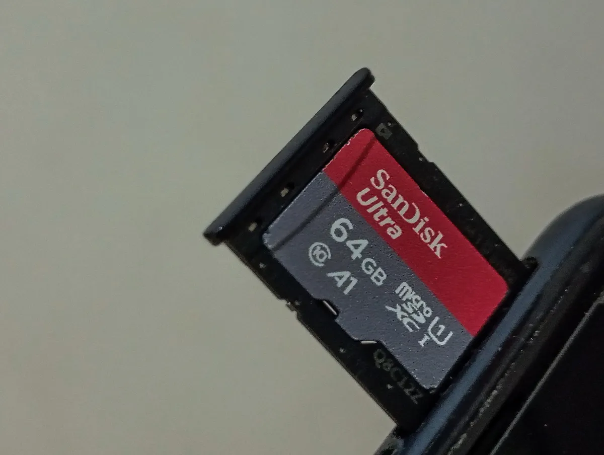 Indonesia - March 20, 2025: Storage Expansion Using a 64GB MicroSD Card in a Device