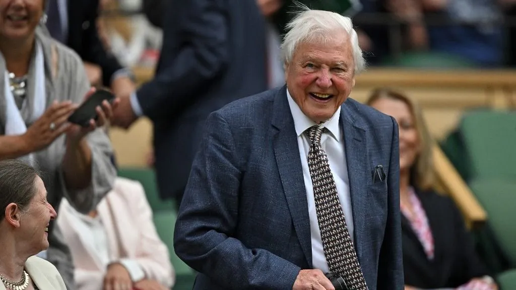 Sir David Attenborough arrives on court to watch the Men's singles tennis matches on the first day of the 2024 Wimbledon Championships at The All England Lawn Tennis and Croquet Club in Wimbledon, southwest London, on July 1, 2024. (Photo by Glyn KIRK / AFP) / RESTRICTED TO EDITORIAL USE
