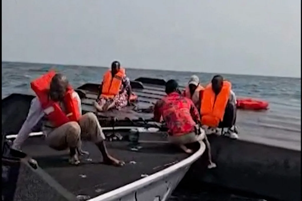 This UGC image, verified by AFP on August 12, 2026, shows passengers being rescued after a boat capsized on Zimbabwes Lake Kariba following an encounter with strong waves on August 11, 2026. At least 15 people were killed and 27 remain missing when an overcrowed ferry on Zimbabwe's Lake Kariba capsized, authorities said on August 12, 2026. The boat, which provides transport between the northern town of Kariba and several islands and fishing camps, overturned after hitting strong waves. (Photo by -UGC / Maxton Kanhema / AFP) / RESTRICTED TO EDITORIAL USE  MANDATORY CREDIT «  AFP PHOTO / Maxton Kanhema  » - NO MARKETING NO ADVERTISING CAMPAIGNS  DISTRIBUTED AS A SERVICE TO CLIENTS [- NO ARCHIVE ]
