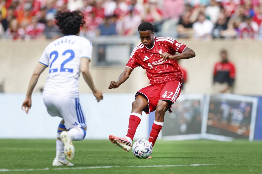 Liverpool's midfielder #42 Trey Nyoni kicks the ball against Leeds United's midfielder #22 Ao Tanaka during the first half of the pre-season friendly football match between Liverpool FC and Leeds United FC at Soldier Field in Chicago, Illinois, on August 2 2026. (Photo by KAMIL KRZACZYNSKI / AFP)