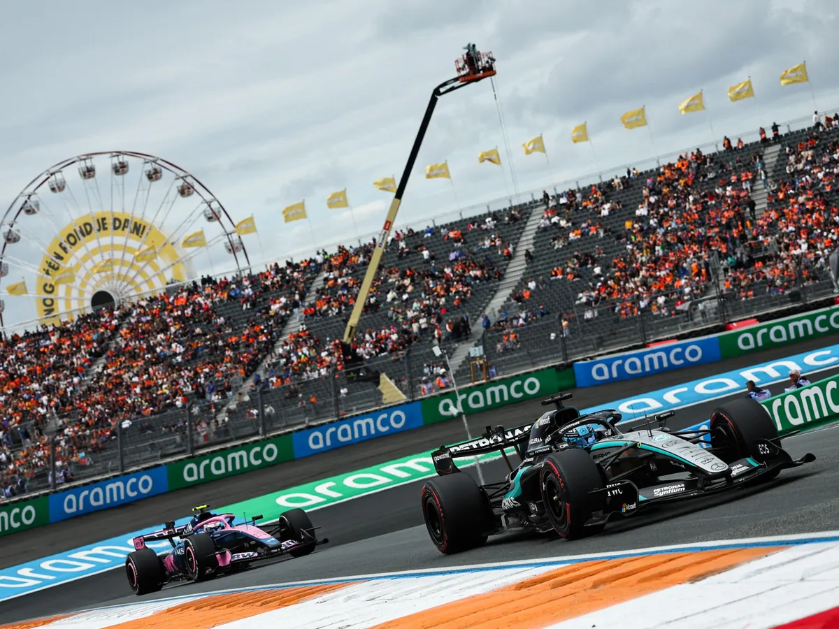 Alpine's Argentine driver Franco Colapinto and Mercedes' British driver George Russell drive during the first practice session of the Formula One Dutch Grand Prix at The Circuit Zandvoort, western Netherlands, on August 21, 2026. (Photo by SIMON WOHLFAHRT / AFP)