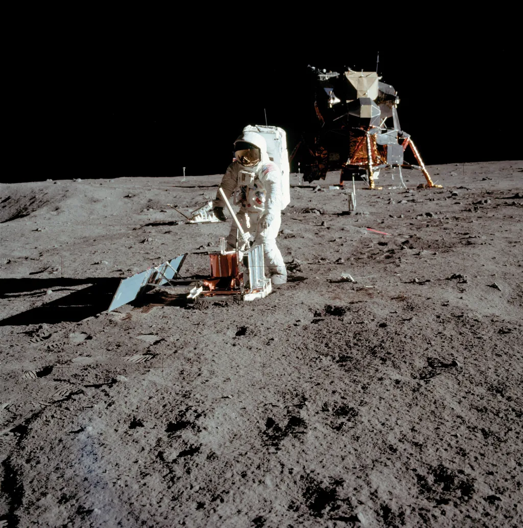 Neil Armstrong, NeilArmstrong, Apollo 11 space mission US astronaut Buzz Aldrin is seen conducting experiments on the moon's surface in a picture taken by Neil Armstrong after both climbed down the ladder of the lunar module "Eagle"