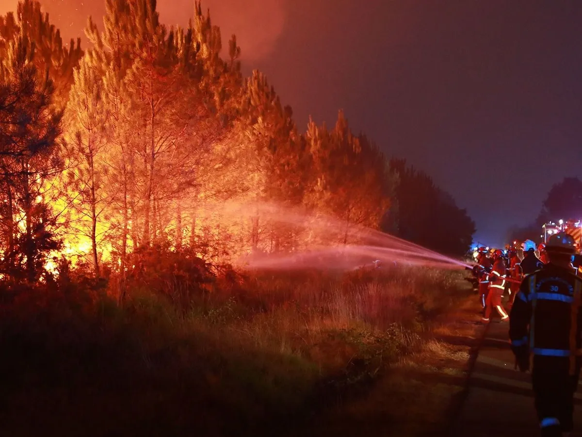 MIRABEL-ET-BLACONS, FRANCE - JULY 28: Firefighters continue battling a wildfire near the town of Mirabel-et-Blacons in southeastern France on July 28, 2026, as high temperatures, low humidity and shifting winds complicate containment efforts while authorities evacuate thousands of people from campsites in the country's southwest. In southwestern France, authorities evacuated around 4,000 people from campsites in Lacanau, according to the Gironde prefecture. (Photo by Mohamad Salaheldin Abdelghani Alsayed/Anadolu via Getty Images)