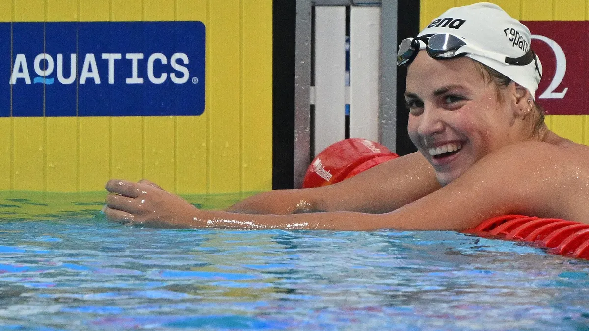 Hungary's Vivien Jackl celebrates placing first in the Swimming Women's 1500m Freestyle Final during the LEN European Aquatics Championships, at the Milan Gale Muskatirovic sports centre in Belgrade, on June 21, 2024. (Photo by ANDREJ ISAKOVIC / AFP) / The erroneous mention[s] appearing in the metadata of this photo by ANDREJ ISAKOVIC has been modified in AFP systems in the following manner: [Vivien Jackl] instead of [Vicien Jackl]. Please immediately remove the erroneous mention[s] from all your online services and delete it (them) from your servers. If you have been authorized by AFP to distribute it (them) to third parties, please ensure that the same actions are carried out by them. Failure to promptly comply with these instructions will entail liability on your part for any continued or post notification usage. Therefore we thank you very much for all your attention and prompt action. We are sorry for the inconvenience this notification may cause and remain at your disposal for any further information you may require.