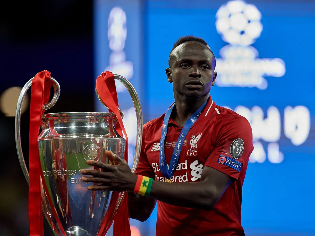 Sadio Mane of Liverpool celebrates with the trophy after winning the UEFA Champions League Final between Tottenham Hotspur and Liverpool at Estadio Wanda Metropolitano on June 1, 2019 in Madrid, Spain. (Photo by Jose Breton/NurPhoto) (Photo by Jose Breton / NurPhoto via AFP)