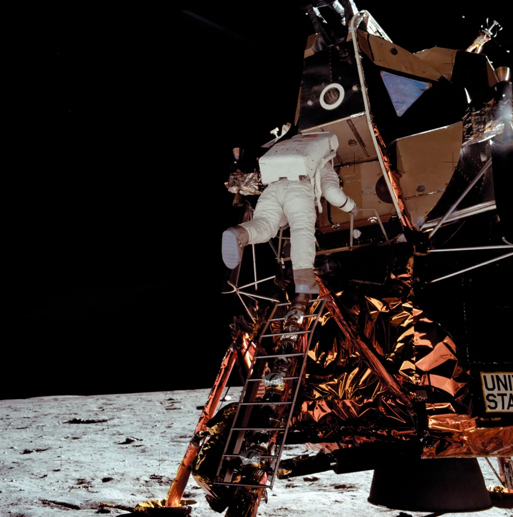 Neil Armstrong, NeilArmstrong, US astronaut Buzz Aldrin climbs down the ladder from the lunar module "Eagle" 15 minutes after Neil Armstrong on July 21, 1969. The two astronauts of the Apollo 11 mission are the first men in history t