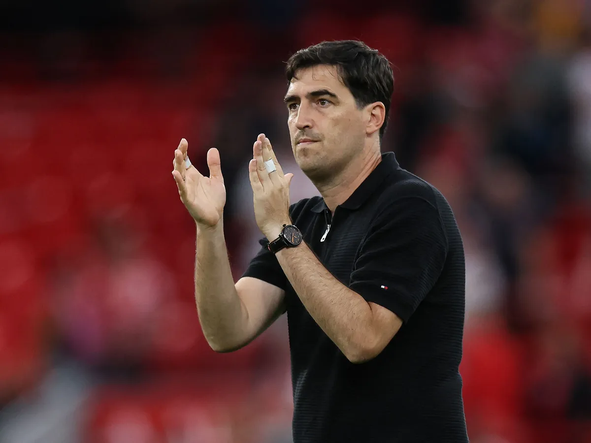Liverpool's Spanish head coach Andoni Iraola applauds the supporters at the end of the pre-season friendly football match between Liverpool and Como at Anfield in Liverpool, north west England on August 16, 2026. (Photo by Darren Staples / AFP)