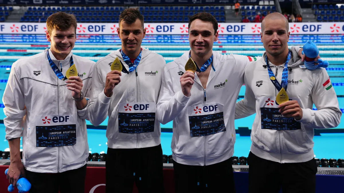Members of team Hungary pose with their gold medal on the podium of the men's 4x100m freestyle relay swimming event during the LEN European Aquatics Championships at the Olympic Aquatic Centre in Saint-Denis, northern suburbs of Paris, on August 13, 2026. (Photo by Dimitar DILKOFF / AFP)