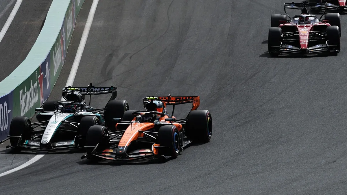 (From L) Mercedes' Italian driver Kimi Antonelli and McLaren's British driver Lando Norris drive during the restart of the Formula One Dutch Grand Prix at The Circuit Zandvoort, western Netherlands, on August 23, 2026. (Photo by SIMON WOHLFAHRT / AFP)