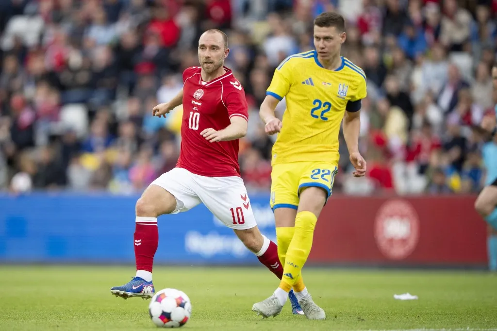 Denmark's Christian Eriksen in action with Ukraine's Mykola Matviyenko during the international football match between Denmark and Ukraine at Odense Stadium on Sunday, June 7, 2026. (Photo: Bo Amstrup/Ritzau Scanpix) (Photo by BO AMSTRUP / Ritzau Scanpix via AFP)