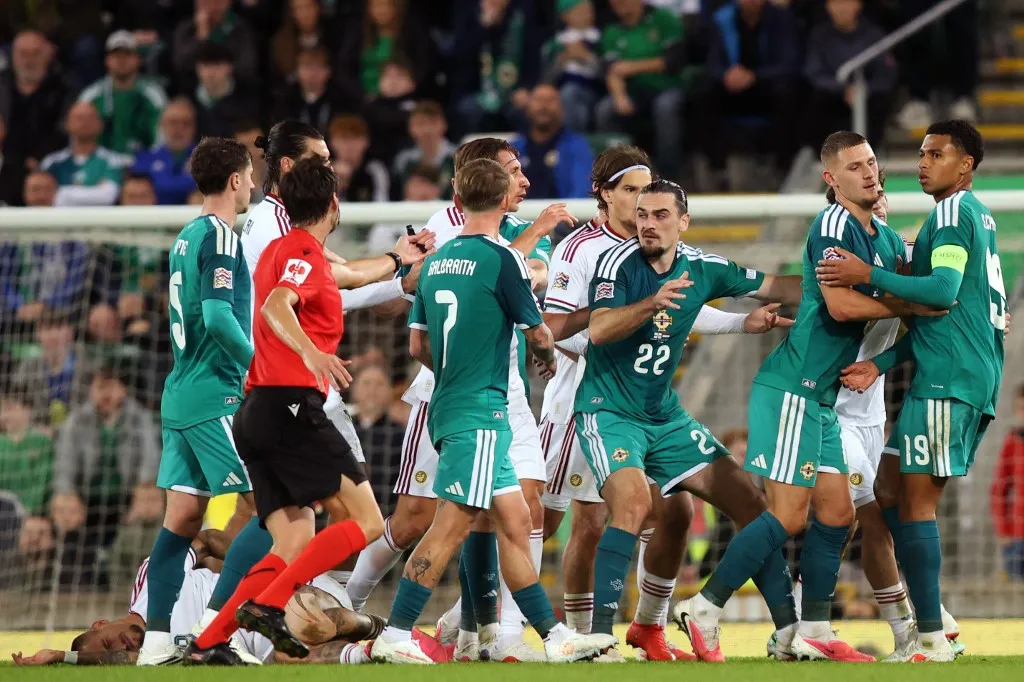 Players clash as the half-time whistle is blown during the UEFA Nations League, League B, Group 2 match between Northern Ireland and Hungary at Windsor Park in Belfast, Northern Ireland on September 28, 2026. (Photo by Paul Faith / AFP)