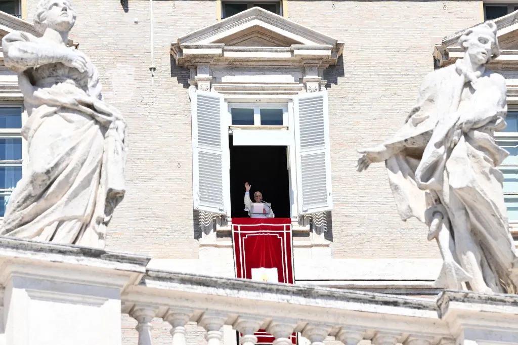 Pope Leo XIV waves to the crowd from the window of the apostolic palace overlooking St Peter's Square during his Sunday Angelus prayer at the Vatican on September 13, 2026 (Photo by Alberto PIZZOLI / AFP)